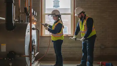 Professional plumber repairing a pipe in Hoboken, NJ for reliable plumbing service